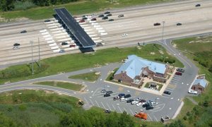 Photo of Dover Toll Plaza on Route 1 in Dover. The photos is an aerial picture of the toll booths and the Dover Toll Plaza Administration Building.